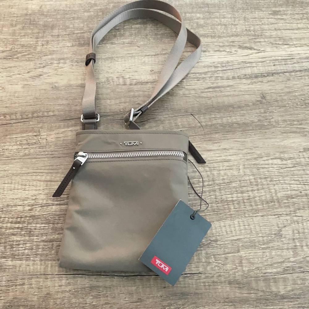 NWT: Tumi Cassandra mini pocket bag. Mostly nylon with leather detail.